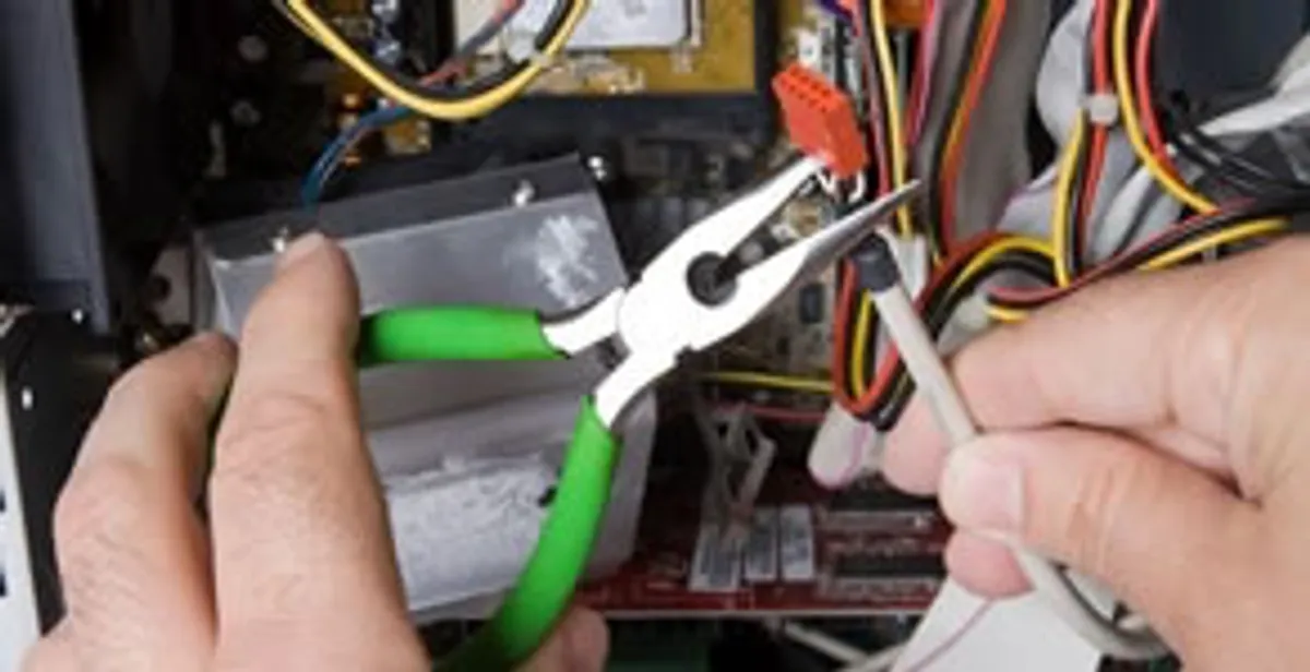 Licensed electrical contractor performing electrical repair with tools in Salida, CA
